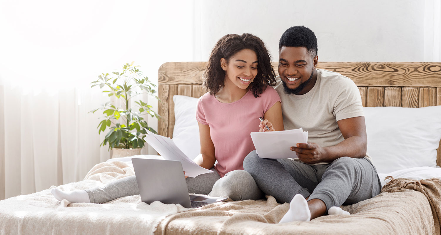 Couple relaxing together at home in their rented property.