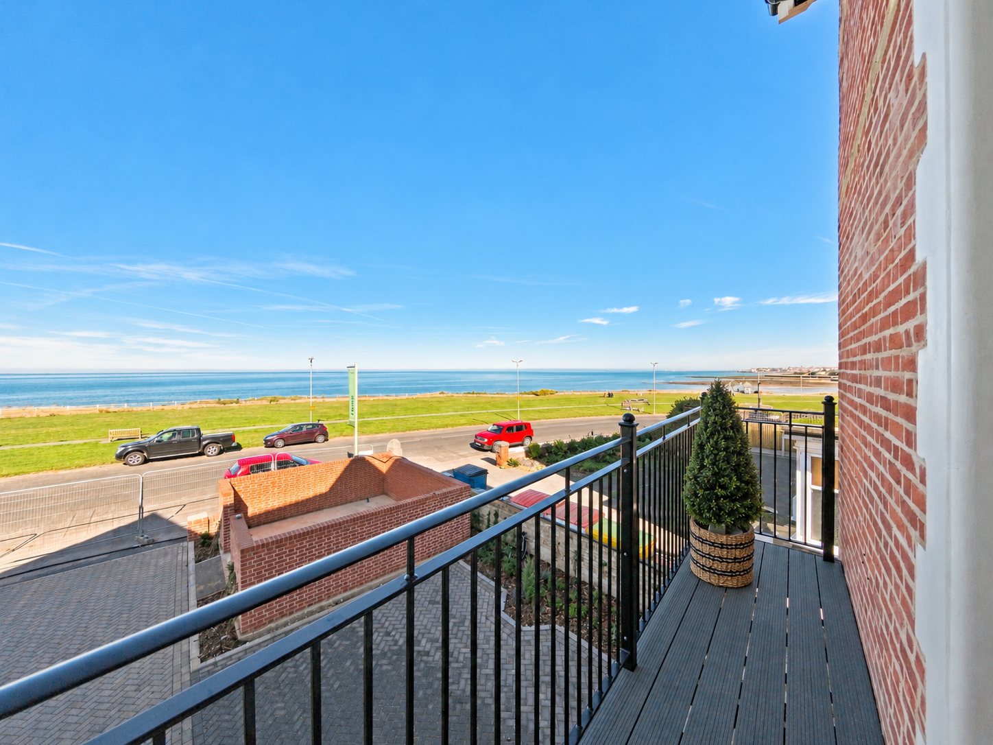 View from a Chalk House balcony across Sea Road and the green to the sea