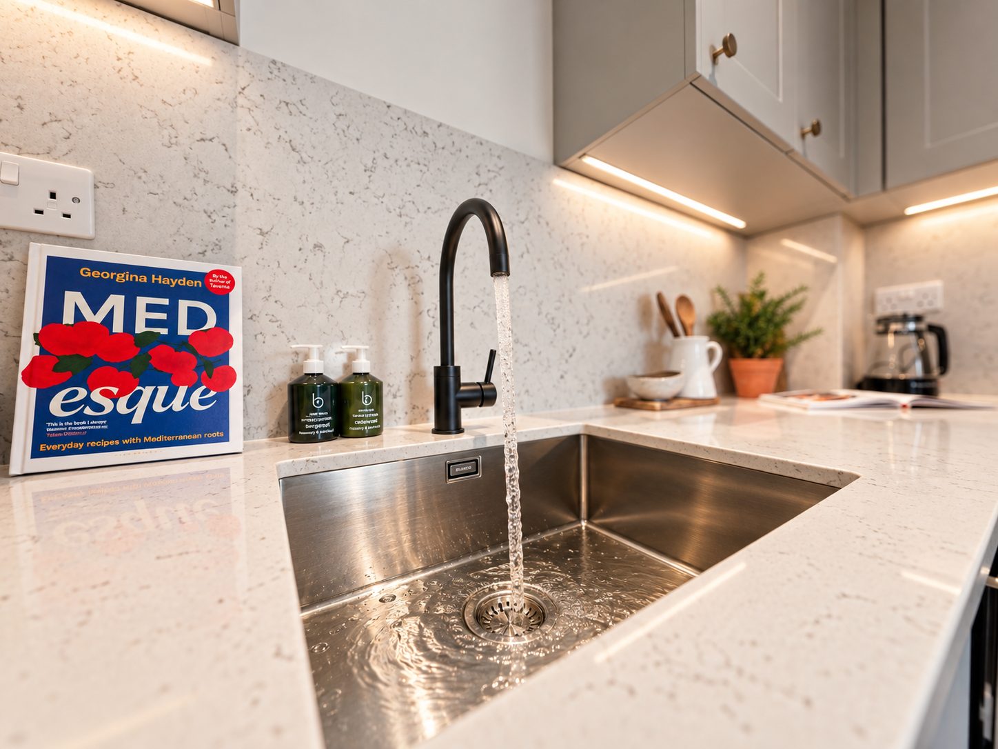 Under mounted sink and matt black tap